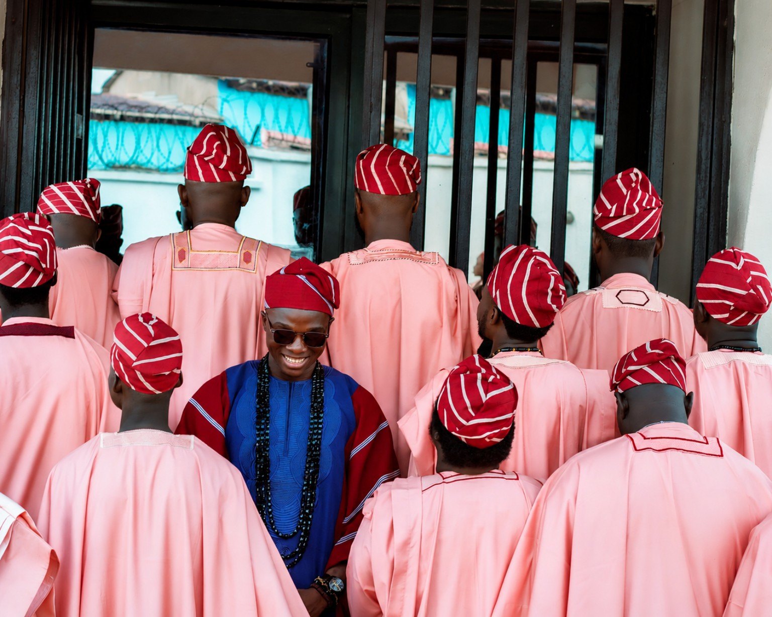 A group portrait at a celebration in matching traditional dress