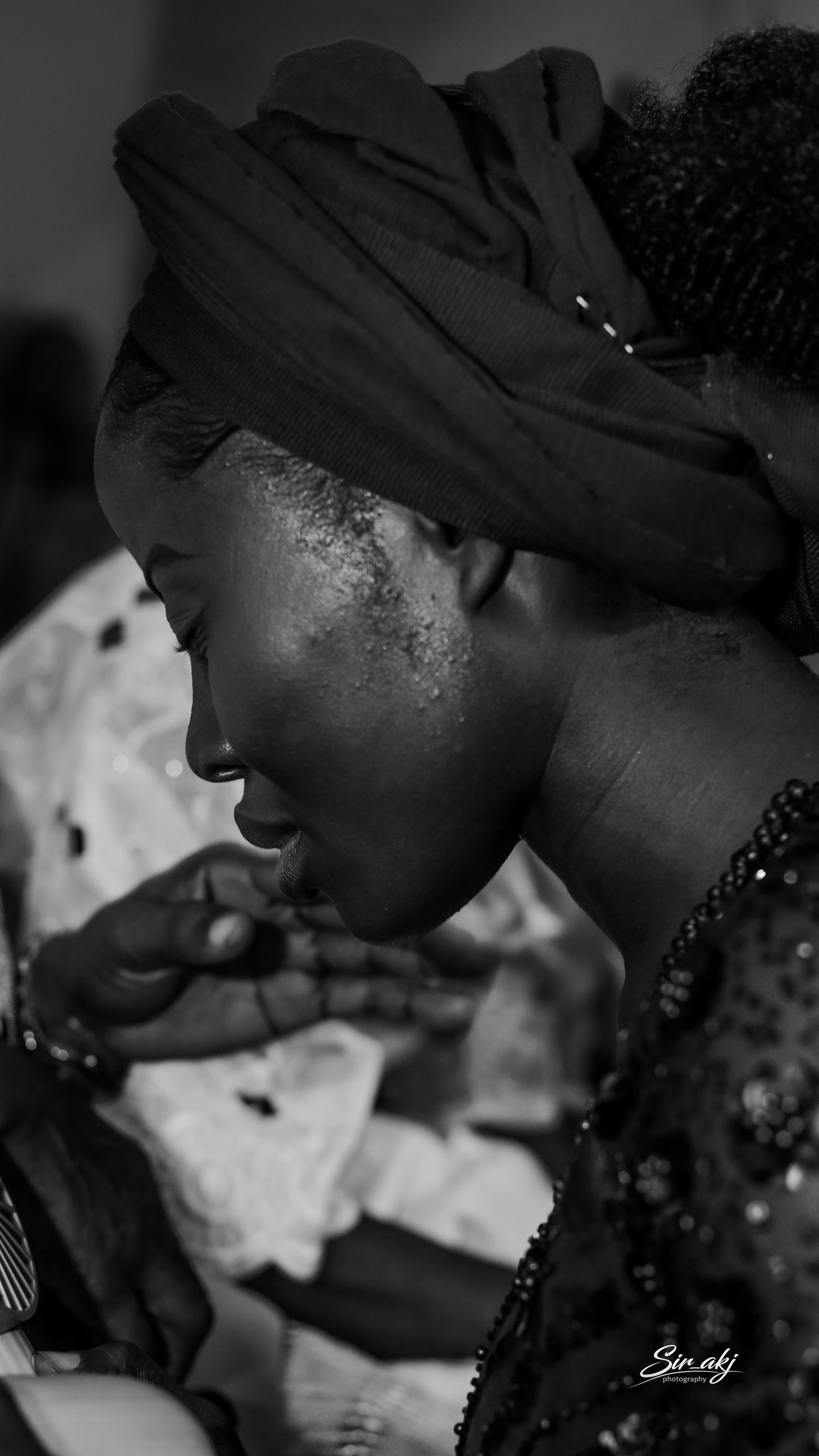 A black and white side profile portrait